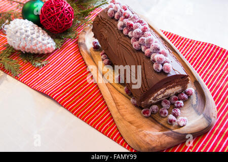 Buche de Noel cake with Christmas decoration. Stock Photo