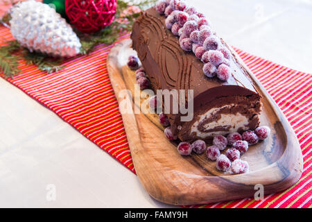 Buche de Noel cake with Christmas decoration. Stock Photo