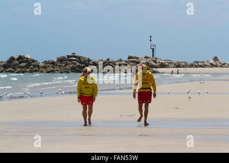 Adelaide Australia. 2nd January 2016. Surf and Rescue volunteers patrol a stretch of beach walk in front of the spot where two boys aged eleven died from a drowning accident on New Years Day whilst swimming at the popular Glenelg beach in Adelaide after falling off rocks and getting into difficulty Credit:  amer ghazzal/Alamy Live News Stock Photo