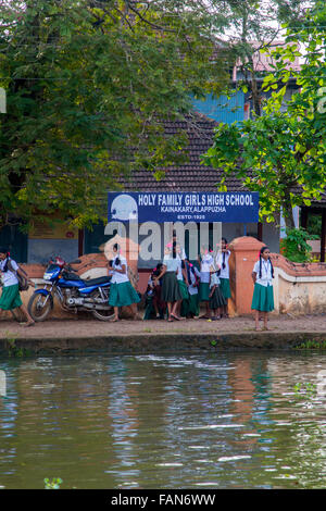 KERALA, INDIA - OCTOBER 16, 2015: Unindetified schoolgirls at backwaters in Kerala, India. The backwaters are an extensive netwo Stock Photo