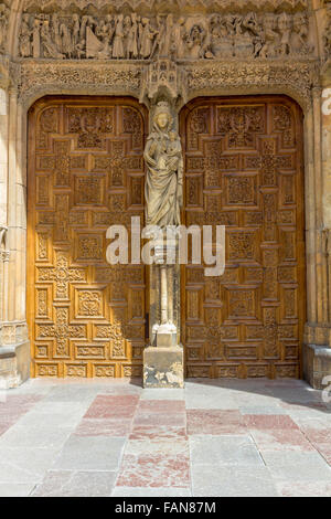 Old carved wooden door of a church Stock Photo