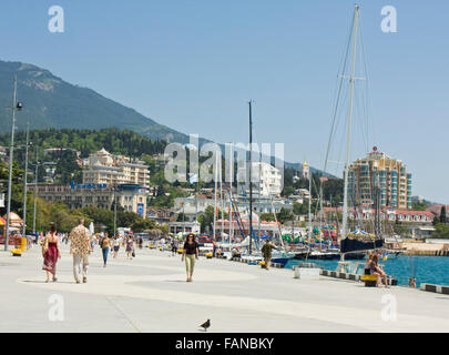 Yalta, Ukraine - May 11, 2012: sea quay with hotels on shore and yachts in harbour, May 11, 2012, in town Yalta, region Crimea,  Stock Photo