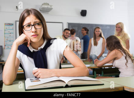 Lonely student being bullied by group of brutish classmates looking ...