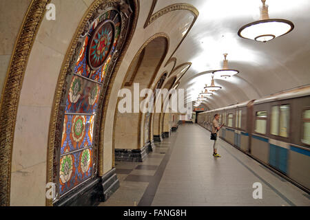 A single passenger waits for a train on the platform in Novoslobodskaya on the Moscow Metro, Moscow, Russia. Stock Photo