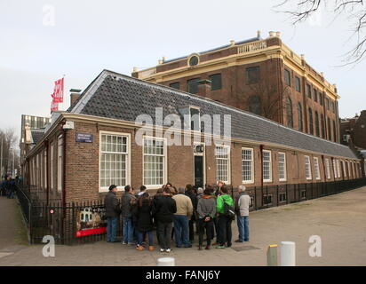 Tourists on J.D. Meijerplein. 17th century Portuguese Synagogue (Portugees-Israëlietische Synagoge) in Amsterdam, Netherlands Stock Photo