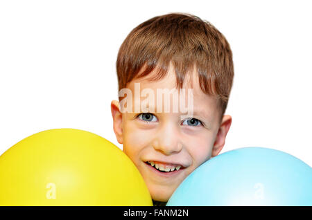 Cute boy with blue and yellow balloons isolated on white Stock Photo