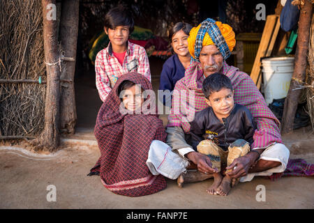 Poor Indian family in front of their house, Pushkar, Rajasthan, India Stock Photo