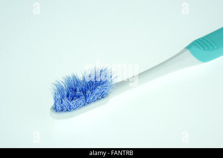 Old toothbrush close-up on white background Stock Photo