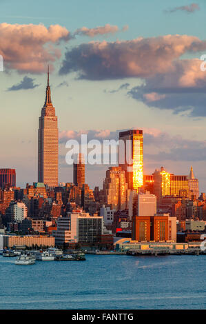 Midtown West Manhattan at sunset with the Empire State Building, One Penn Plaza and the New Yorker Hotel. New York City.