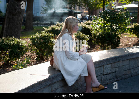 Relaxing after the work. Drinking coffee in the street. NEW YORK, Union Square subway. Between the 14th and 17th and between Uni Stock Photo