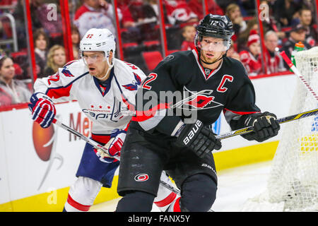 Carolina Hurricanes center Eric Staal (12) and Washington Capitals center Evgeny Kuznetsov (92) during the NHL game between the Washington Capitals and the Carolina Hurricanes at the PNC Arena. Stock Photo