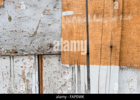 Old dirty wooden wall, natural and painted in white. Stock Photo