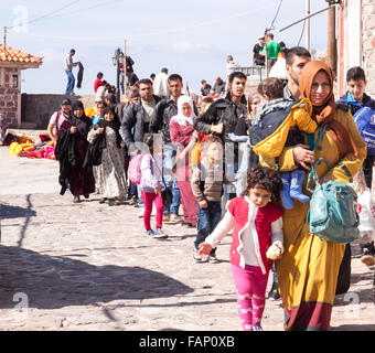 Syrian refugees and immigrant  families having just arrived in  the town of Molyvos on the island of Lesbos Greece by inflatable boats Stock Photo