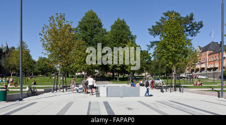 UMEA, SWEDEN ON AUGUST 04, 2015. Street view a summer day. Unidentified people in the park. Boardwalk and trees. Editorial use. Stock Photo