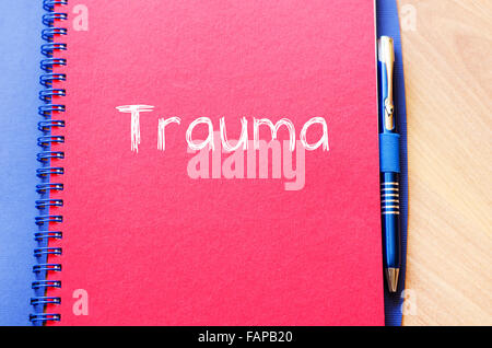 Trauma text concept write on notebook with pen Stock Photo