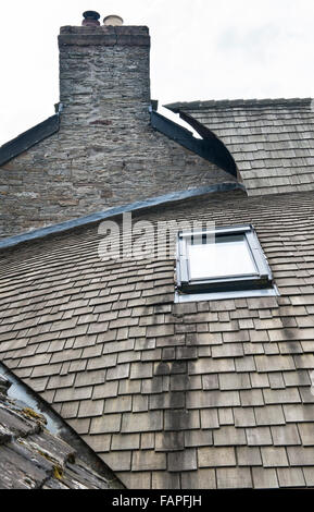 Herefordshire, UK. A self built house, timber clad, with a curved roof covered with wooden cedar shingles Stock Photo