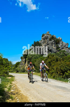 Bikers on the cycle path Greenway Vía Verde de la Sierra between Coripe and Olvera, Coripe, Andalusia, Spain Stock Photo