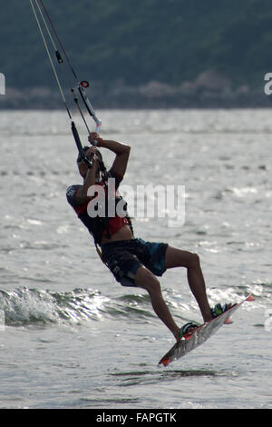 Close-up of male kite surfer taking off Stock Photo