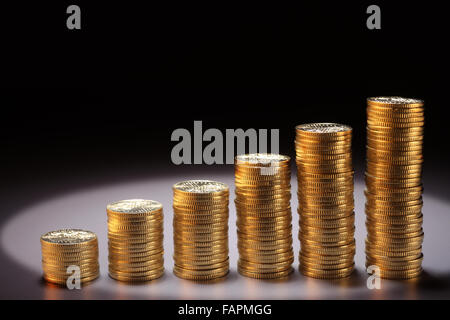 numbers stack of coin form a graph Stock Photo