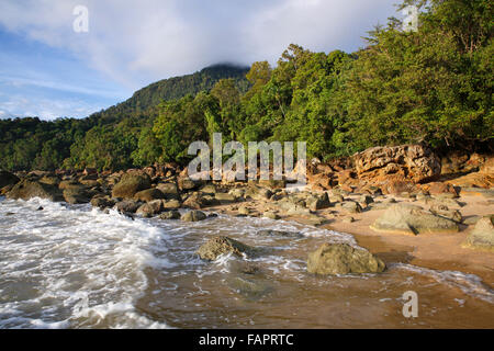 Beach with rocks and rainforest on the coast, Permai Rainforest in Santubong, Sarawak, Borneo, Malaysia Stock Photo