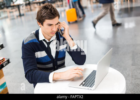 Businessman talking on smart phone,working laptop Stock Photo
