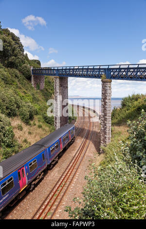 First Great Western train on the Teignmough to Dawlish coastal railway line in Devon Stock Photo