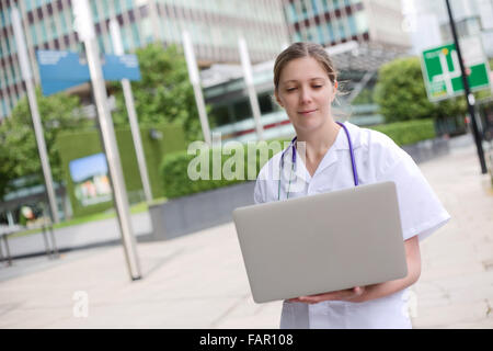 young doctor using a laptop
