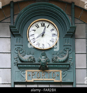 Old clock at railway station in Porto, Portugal Stock Photo