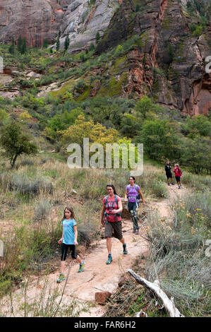 Two women and one girl hiking in Zion National Park, Utah. Stock Photo