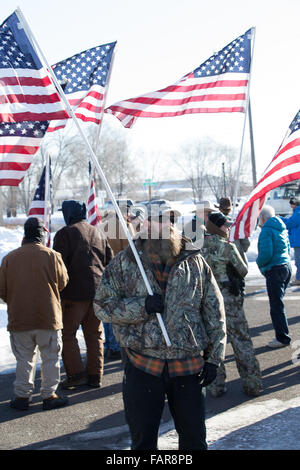 Burns, Oregon, USA. 02nd Jan, 2016. Man Holds American Flag at Rally for Hammond Family in Burns Origon Credit:  Marvin Cotney/Alamy Live News Stock Photo