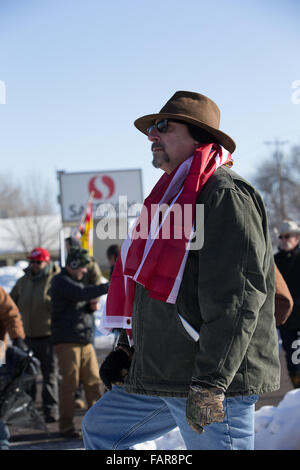 Burns, Oregon, USA. 02nd Jan, 2016. Man stands with flag in Burns Oregon Credit:  Marvin Cotney/Alamy Live News Stock Photo