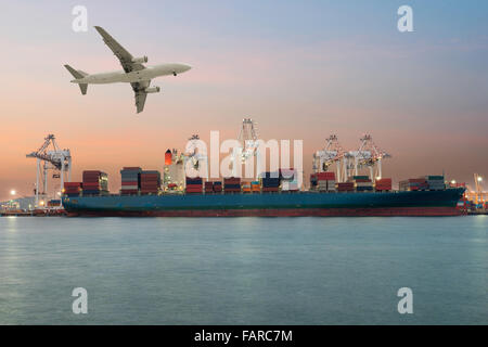 Container ship in import,export port morning light of loading ship yard use for freight and cargo shipping vessel transport Stock Photo