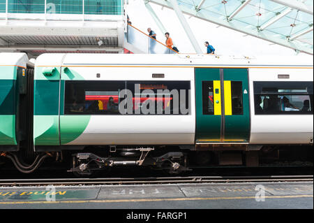 Train pulling into Clapham Junction train Station, London, England, UK. Stock Photo