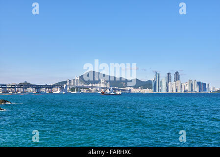 Gwangan Big bridge and Marine City in Busan, Korea. The suspension bridge is a landmark of Busan. Stock Photo