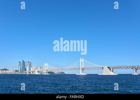 Gwangan Big bridge and Marine City in Busan, Korea. The suspension bridge is a landmark of Busan. Stock Photo