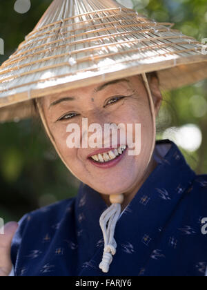 Okinawan woman in traditional costume, Ryukyu Mura, Okinawa, Japan Stock Photo