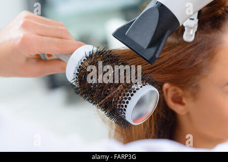 Process of shaping the hairdo. Stock Photo