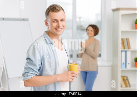 Two colleagues on coffee break at the office. Stock Photo