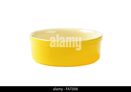 Small empty yellow souffle dish Stock Photo