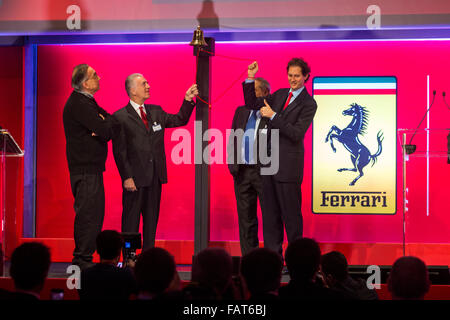 Milano, Italy. 04th Jan, 2016. FCA's chairman John Elkann, FCA's chief executive Sergio Marchionne and Piero Ferrari, vice chairman and son of the founder Enzo ring the bell in Milan Borsa Italiana for the Ferrari stock market launch in Milan. Credit:  Mauro Ujetto/Pacific Press/Alamy Live News Stock Photo