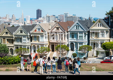 Tourists, Victorian row of houses, Painted Ladies, Postcard Row, Alamo Square, Steiner Street, San Francisco, California, USA Stock Photo