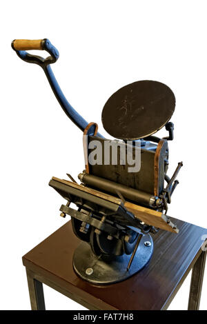 Cast iron table top hand cranked printer Stock Photo