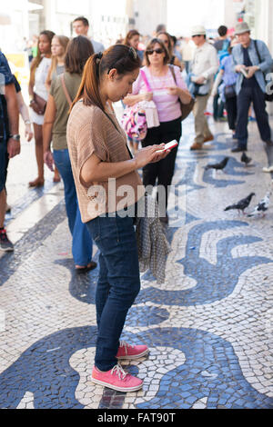 Woman looking at cell phone. Stock Photo