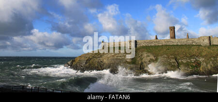 Peel Castle, Peel, Isle of Man. The mouth of Fenella Beach on a stormy day with large, powerful waves crashing on the rocks. Stock Photo