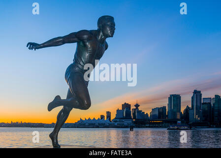 Vancouver skyline and Harry Jerome statue, Stanley Park,  Vancouver, British Columbia, Canada Stock Photo