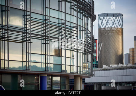 Mediacity Salford Quays Lowry theatre with modern apartment behind   part of the Lowry theatre visible beyond the BBC Office spa Stock Photo