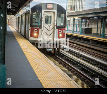 A Flushing Line elevated subway train arrives at the Court Square station in Queens in New York on Saturday, January 2, 2016.  (© Richard B. Levine) Stock Photo
