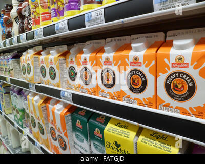 Containers of milk in a supermarket refrigerator in New York Stock Photo -  Alamy