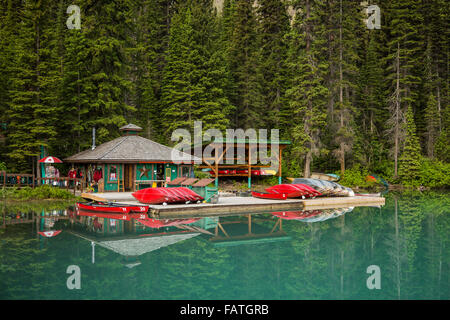 Red canoes on the dock at Emerald Lake, Yoho National Park, British Columbia, Canada. Stock Photo