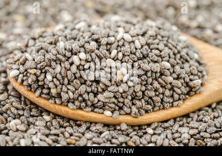 Close up chia seeds in wooden spoon. Stock Photo